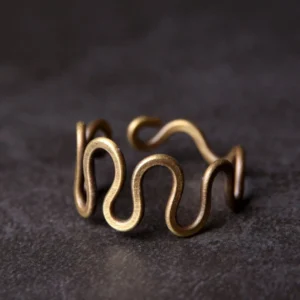 Tibetan curved brass prosperity ring adjustable band front view close-up antique bronze finish