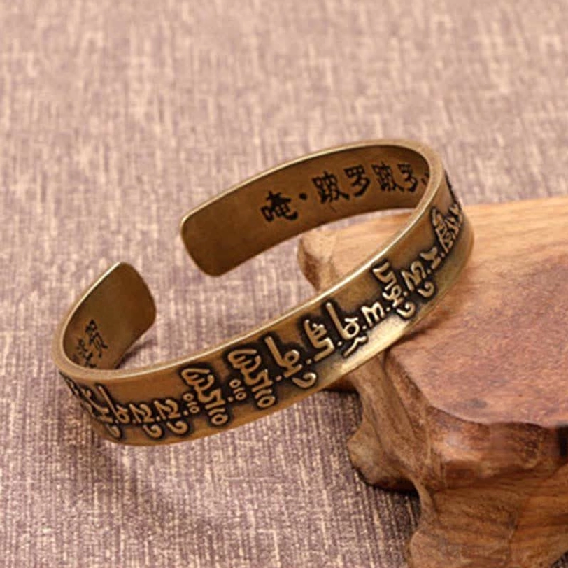 Antique bronze Tibetan cuff bracelet with Chinese and Tibetan Buddhist scripture engravings