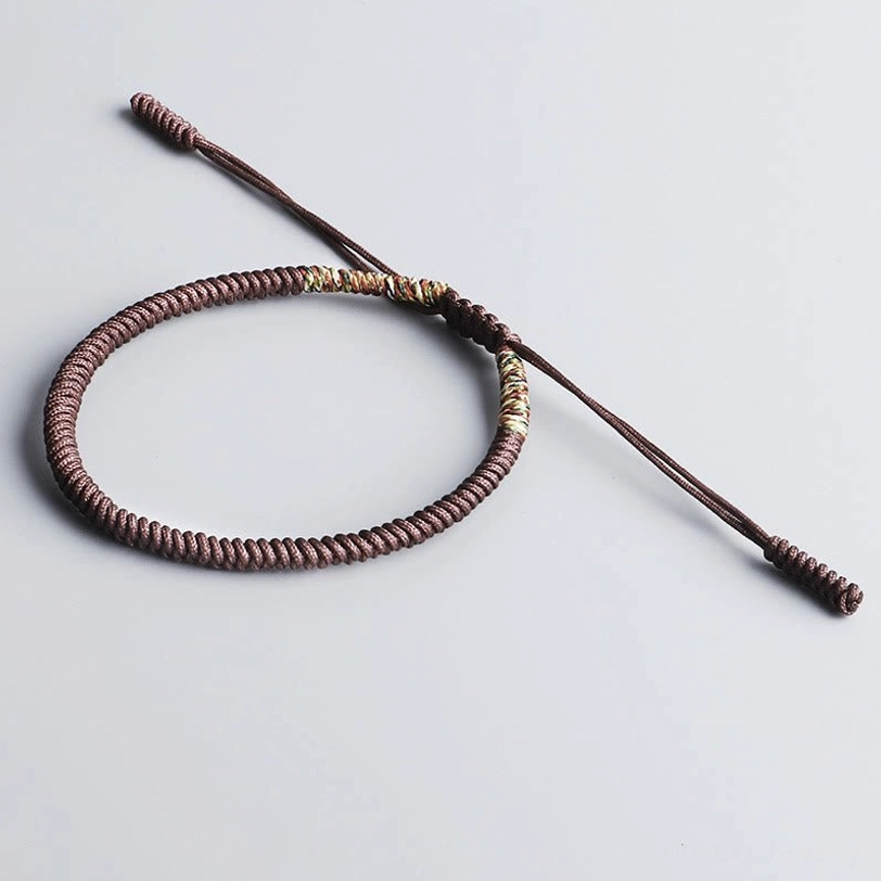 Single brown Tibetan handwoven protective bracelet with adjustable sliding knots