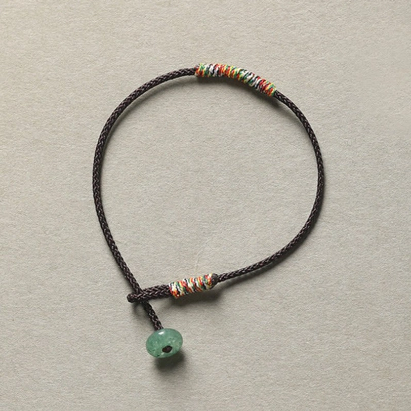 Brown handmade Tibetan braided bracelet with green aventurine stone for protection and grounding