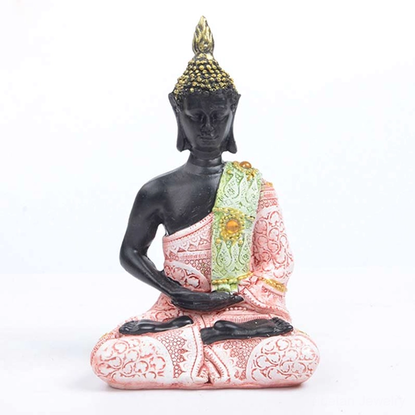 Tibetan Buddha feng shui meditation statue with pink and light green robes, embossed floral patterns, hands in meditation mudra position, black resin body with gold decorative accents