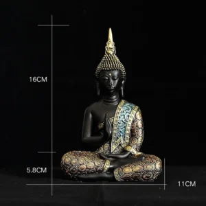 Small Tibetan Buddha decorative statue with size measurement 16cm height, seated cross-legged on dark background
