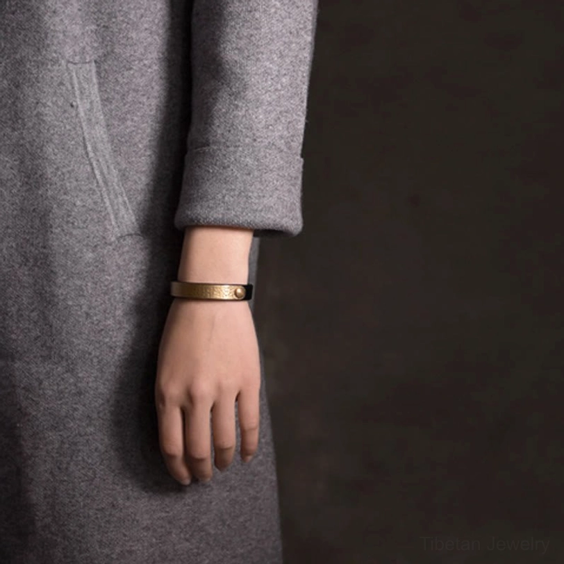 Authentic Tibetan Buddhist-inspired brass leather bracelet for balancing energy and promoting holistic wellness abundance