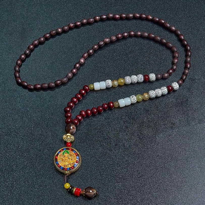 Handcrafted Tibetan Buddhist bead necklace showcasing natural wood and copper accents