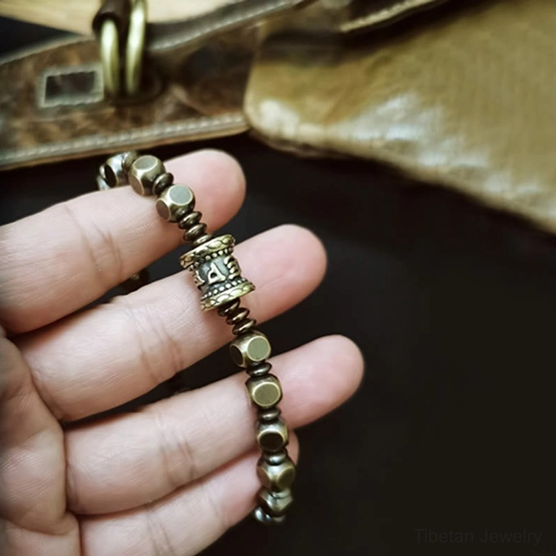 Tibetan Buddhist mantra bracelet lifestyle shot featuring spiritual wellness and mindfulness practice