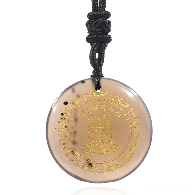 Multiple Tibetan Buddhist pendants arrangement showing handmade craftsmanship