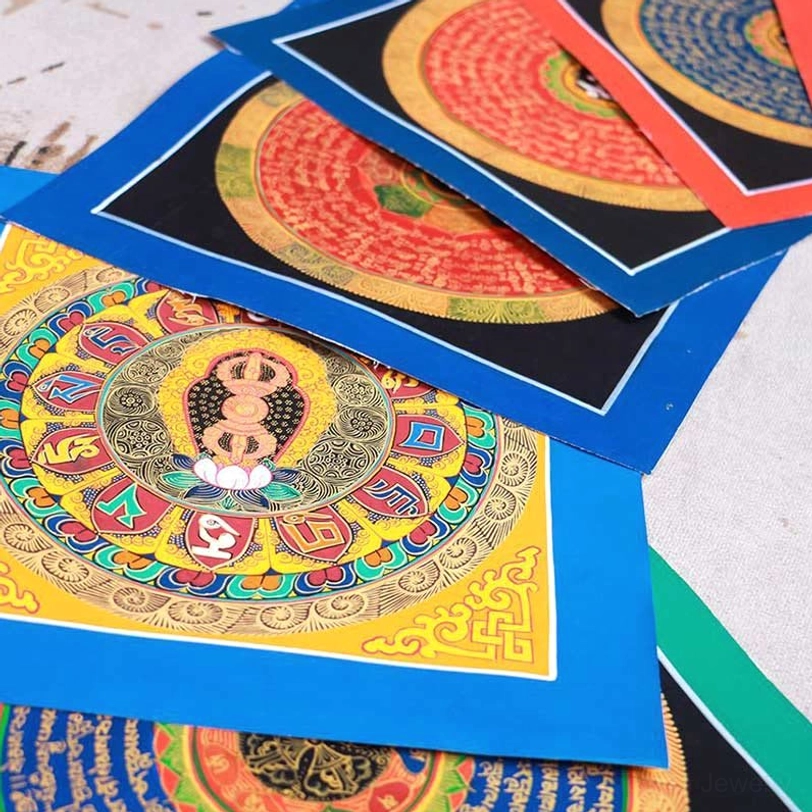 Authentic Tibetan Buddhist thangka painting with gilt Buddha-centered mandala and multi-tone layered silk borders