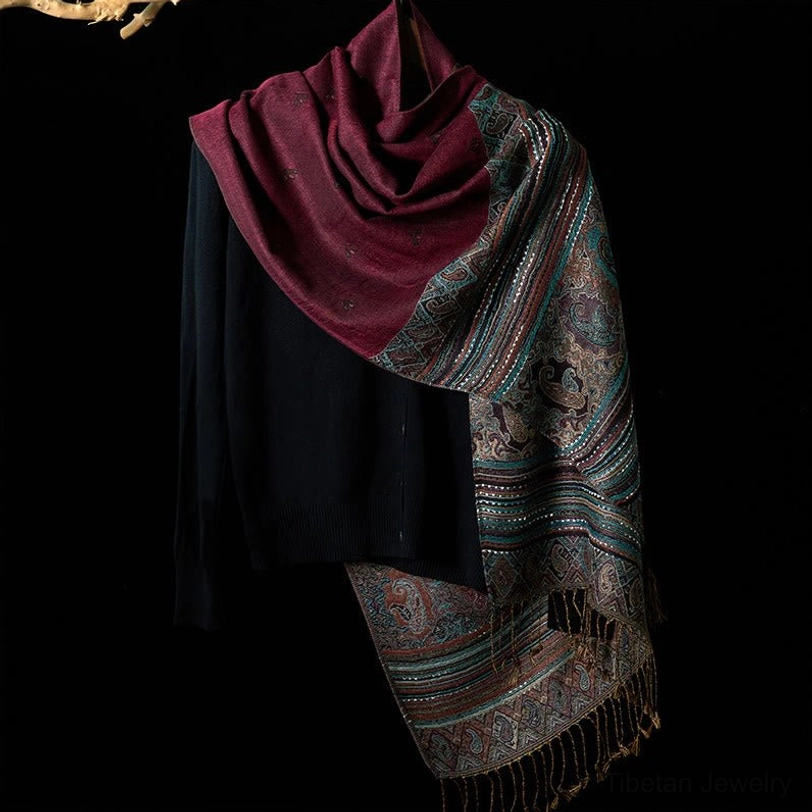 Tibetan paisley tassel shawl front view in dark burgundy tone displaying full woven patterned side panel and solid top section with traditional tassel hem