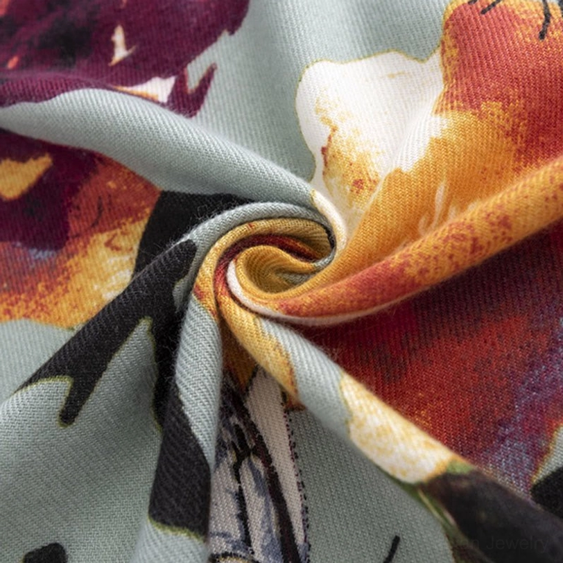 Twisted Tibetan floral scarf close-up showing rich color gradients and butterfly motifs