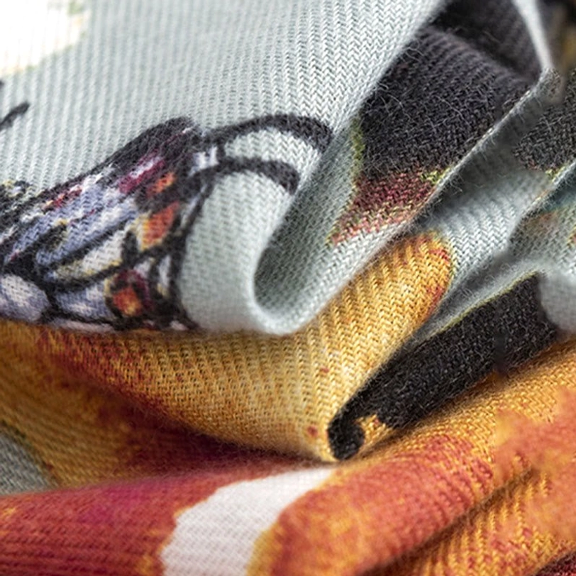Close-up macro shot of Tibetan butterfly floral scarf weave texture and print details