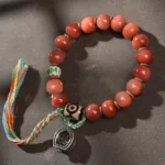 Tibetan camel bone dzi bead bracelet with multicolor tassel and metal prayer charm - authentic Buddhist jewelry