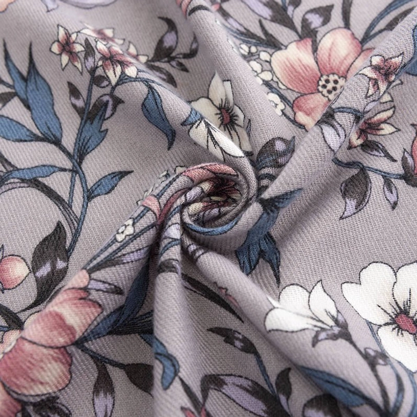 Tibetan scarf fabric close-up side view showing delicate hand-drawn style camellia flower prints on smooth matte textile