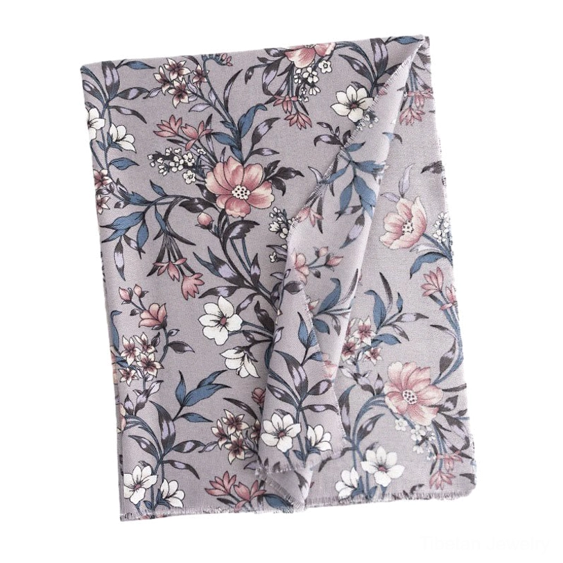 Folded Tibetan camellia floral scarf overhead display, dusk grey wrap with complete retro botanical flower pattern visible