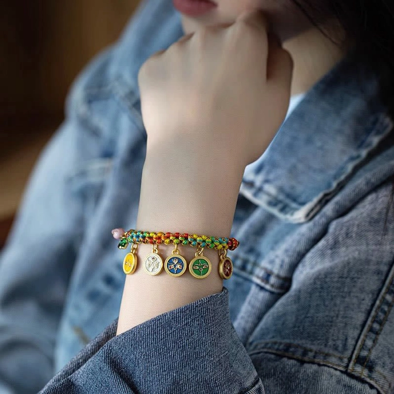 Tibetan braided luck bracelet on wrist with denim jacket background demonstrating versatile casual styling and daily wear
