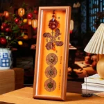 Tibetan cinnabar copper coin fortune photo frame with orange background and bronze ancient coins - front view home décor