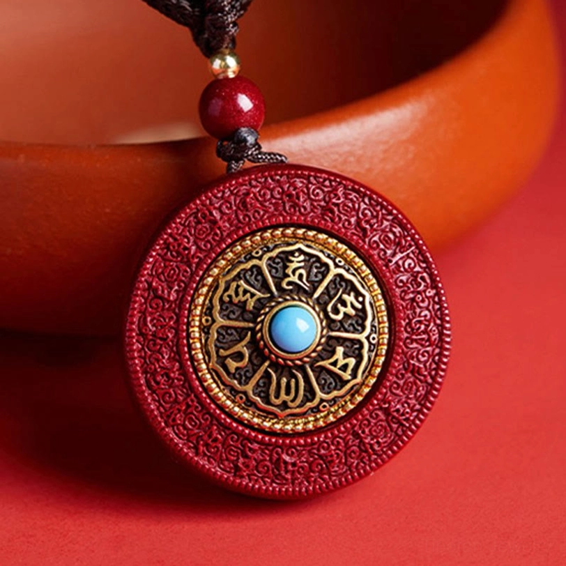 Rotatable Cinnabar Om Mani Padme Hum Buddhist Pendant - Top View with Turquoise Center Stone and Gold Engraved Border