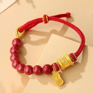 Six true words mantra red string blessing bracelet with adjustable knot and silver charm displayed on cardboard background