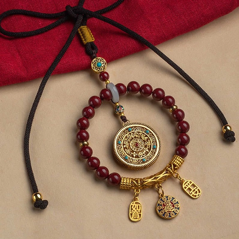 Collection display of tibetan cinnabar ruyi blessing ornaments showing natural color variations and handcrafted uniqueness