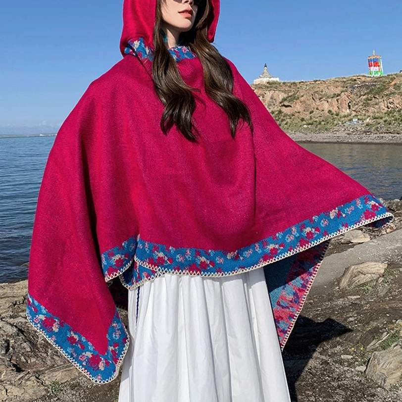 Tibetan hooded cloak detail showing floral embroidery and fine stitching on border trim