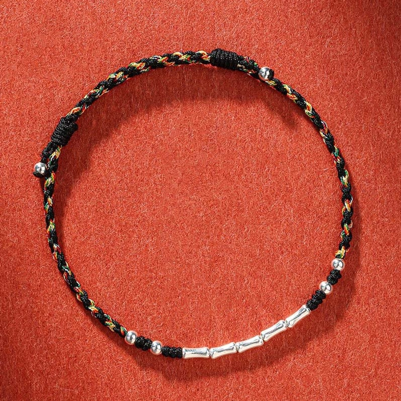 Colorful black Tibetan handmade braided protection bracelet with multicolor threads and silver decorative beads