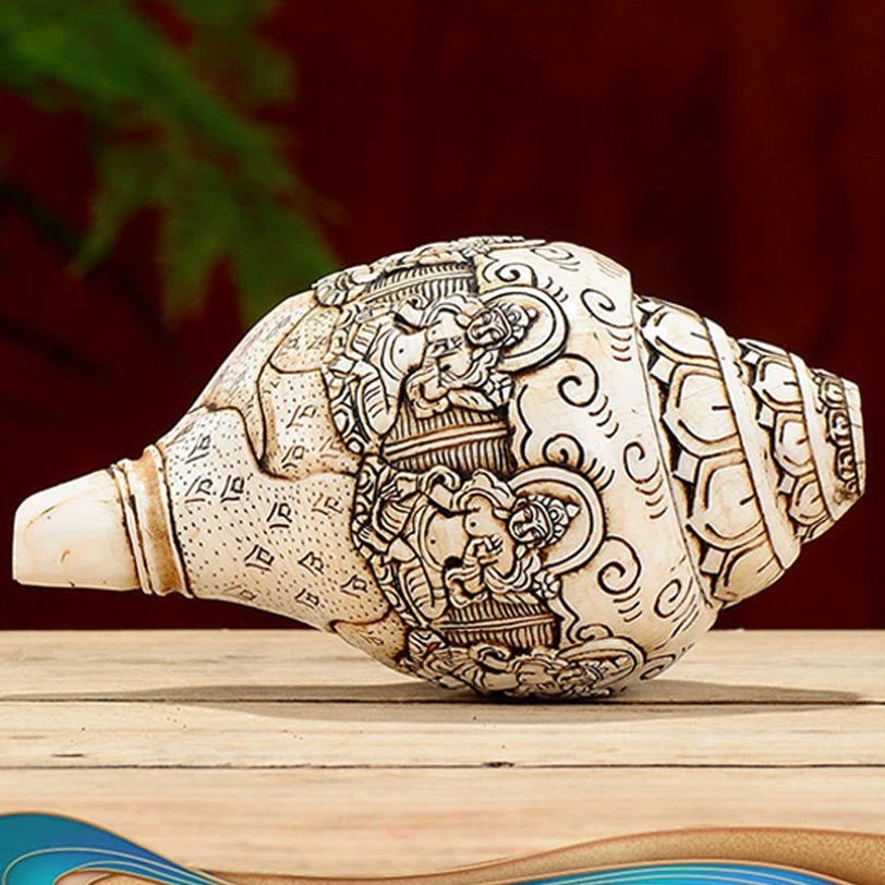 Pale natural Tibetan engraved conch shell with Yellow God of Wealth Buddhist deity carving prosperity symbol