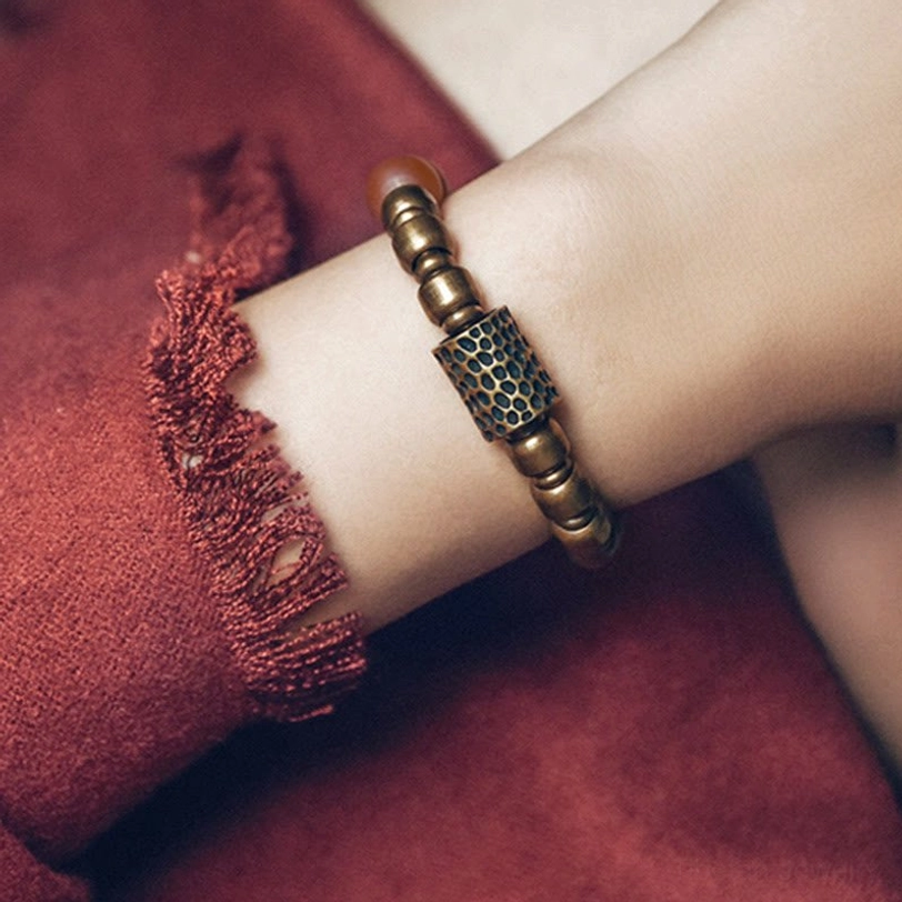 Antiqued copper beaded bracelet with hammered engraved barrel charm and aged bronze accents
