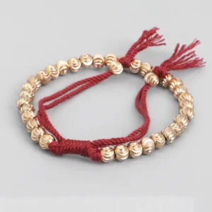 Adjustable Tibetan copper bead prosperity bracelet in wine red - handcrafted cross-placed design