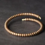 Tibetan copper beaded balance cuff bracelet adjustable unisex flat lay with open cuff design