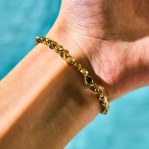 Tibetan copper bead prosperity bracelet worn on wrist close-up, adjustable fit demonstration