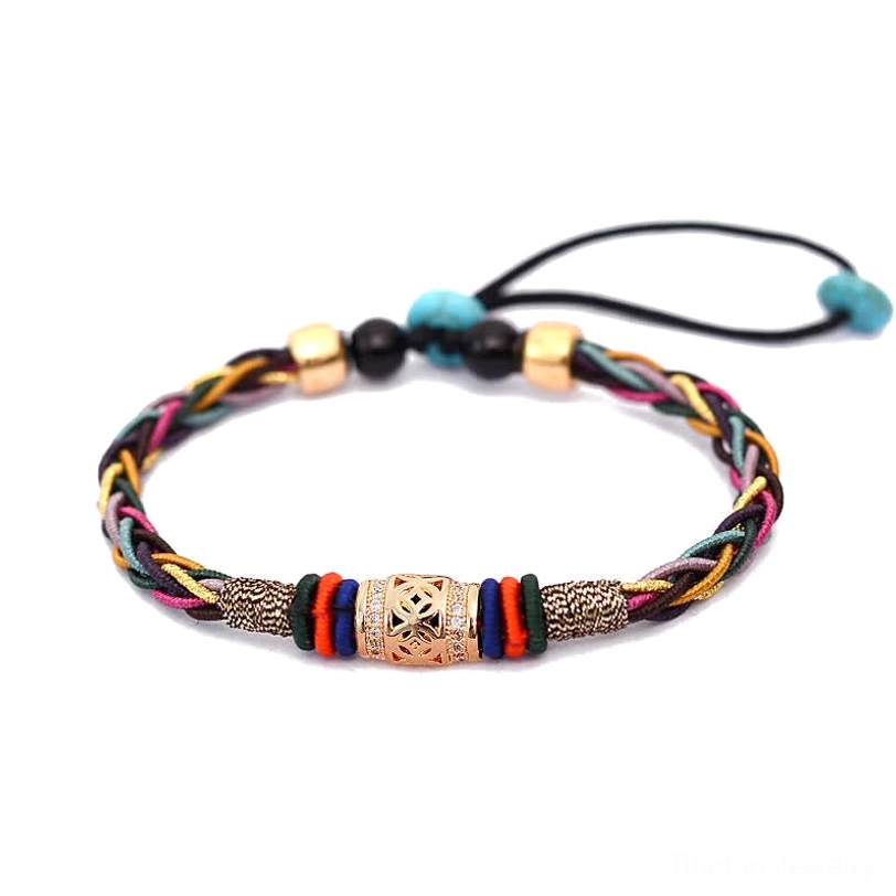 Tibetan eight knot red string bracelet flat lay on white background showing multicolor braid, carved center bead, and pull knot closure