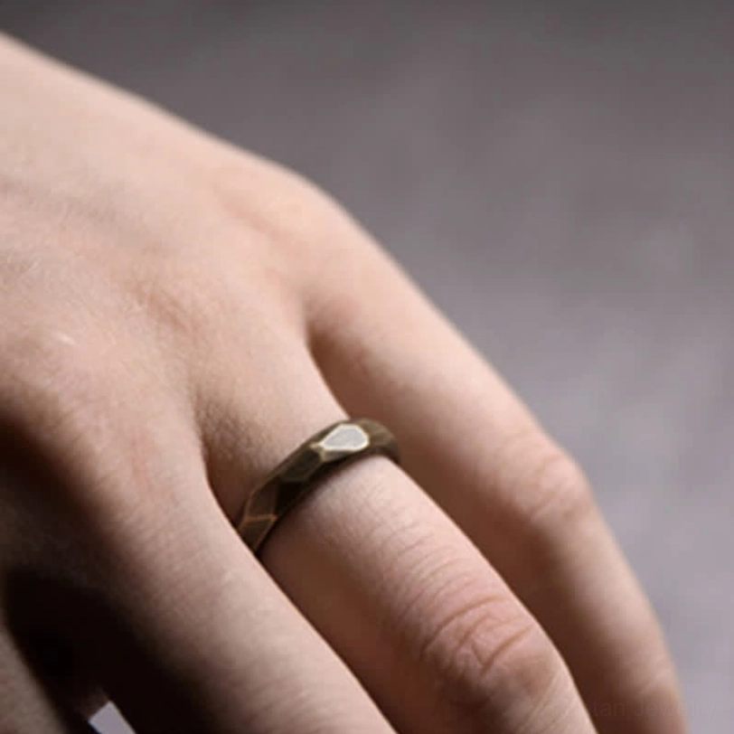 Faceted copper ring hammered texture hand close-up side angle