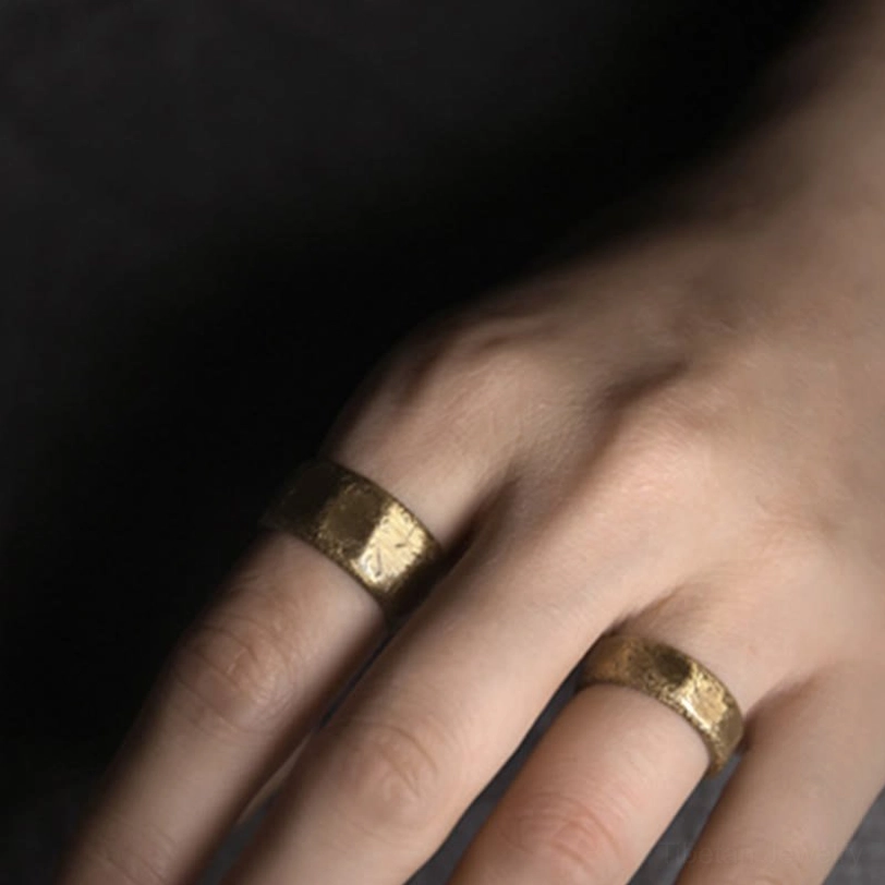 Worn copper prosperity ring on finger - close-up hand photo showing comfortable fit and practical everyday wear