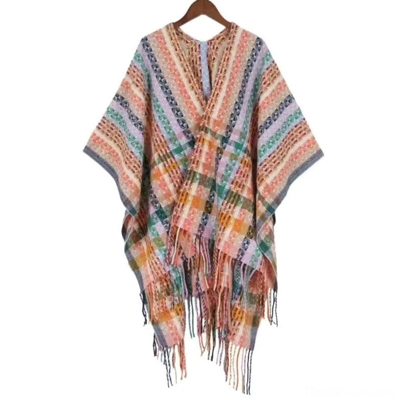Tibetan boho tassel shawl in warm coral color showing colorful stripe design and traditional Himalayan craftsmanship
