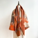Tibetan lotus crane spiritual scarf in warm brown and orange tones, flat lay display showing full pattern and handwoven texture