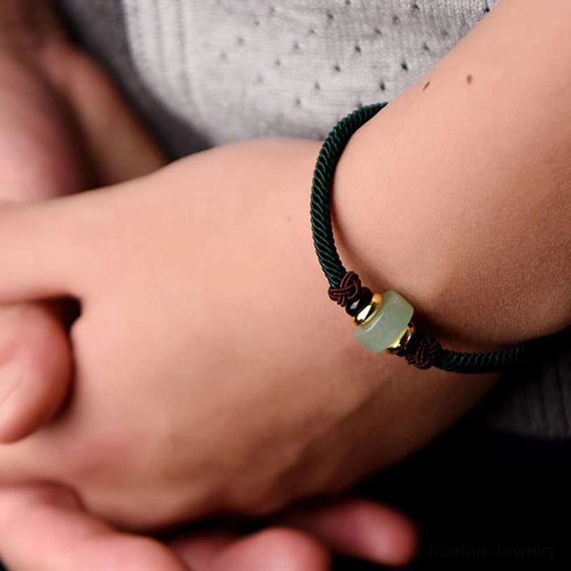 Dark green Tibetan lucky braid bracelet showing aventurine stone with red agate accents and adjustable sizing options