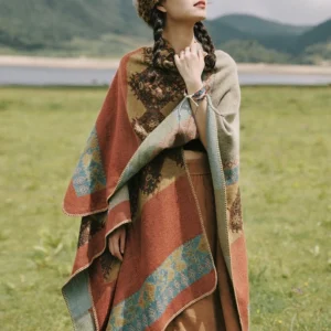 Tibetan diamond pattern wool wrap shawl worn as front half-body view in earthy color with ethnic woven texture by lakeside grassland