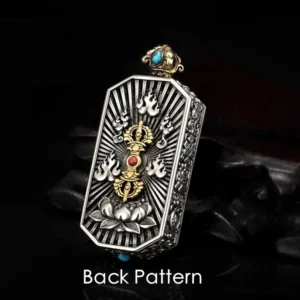 Back view of Tibetan vajra pendant showing radial lotus base design pattern with blue and red gemstone inlays on black background