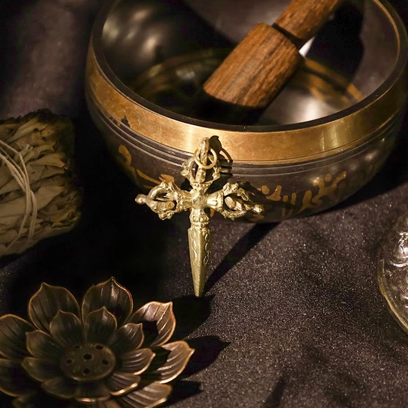 Copper double dorje vajra with singing bowl and wooden mallet - complete Tibetan ritual meditation set with engraved patterns on dark cloth