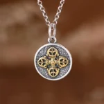 925 sterling silver double dorje vajra pendant necklace front view with dual-tone finish on brown fabric