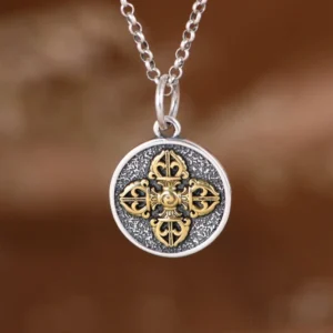 925 sterling silver double dorje vajra pendant necklace front view with dual-tone finish on brown fabric