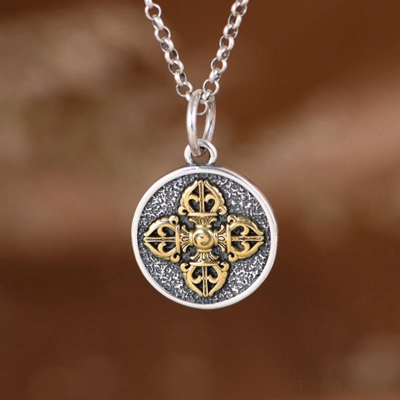 925 sterling silver double dorje vajra pendant necklace front view with dual-tone finish on brown fabric