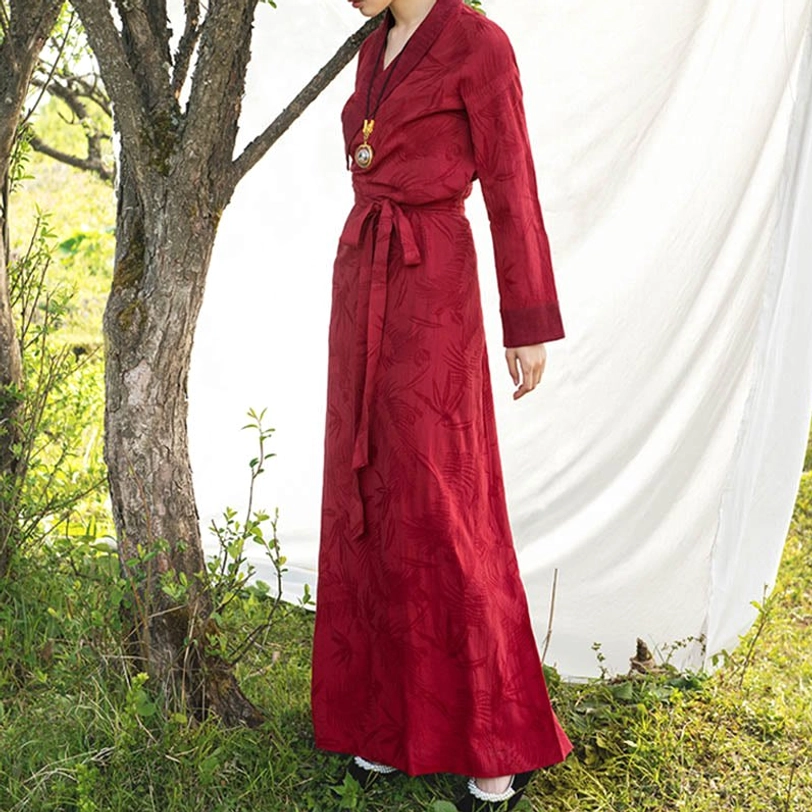 Tibetan wrap dress showing wrap neckline and decorative frog button closure details with traditional Chinese-inspired fastenings