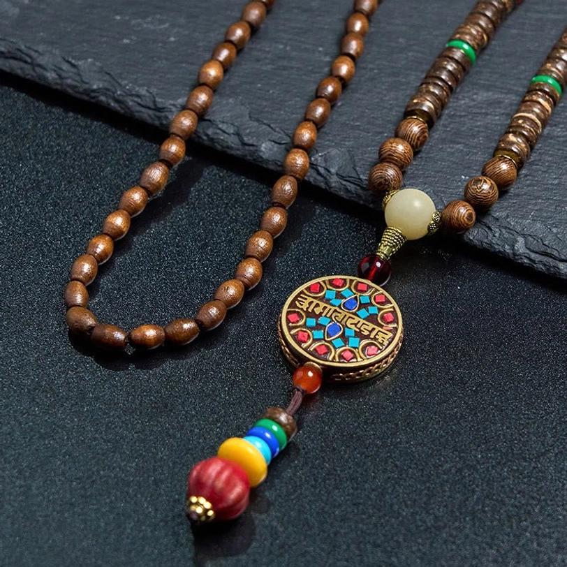 Dual-strand Tibetan mala necklace with wooden beads, enamel mantra pendant, and colorful decorative tassels