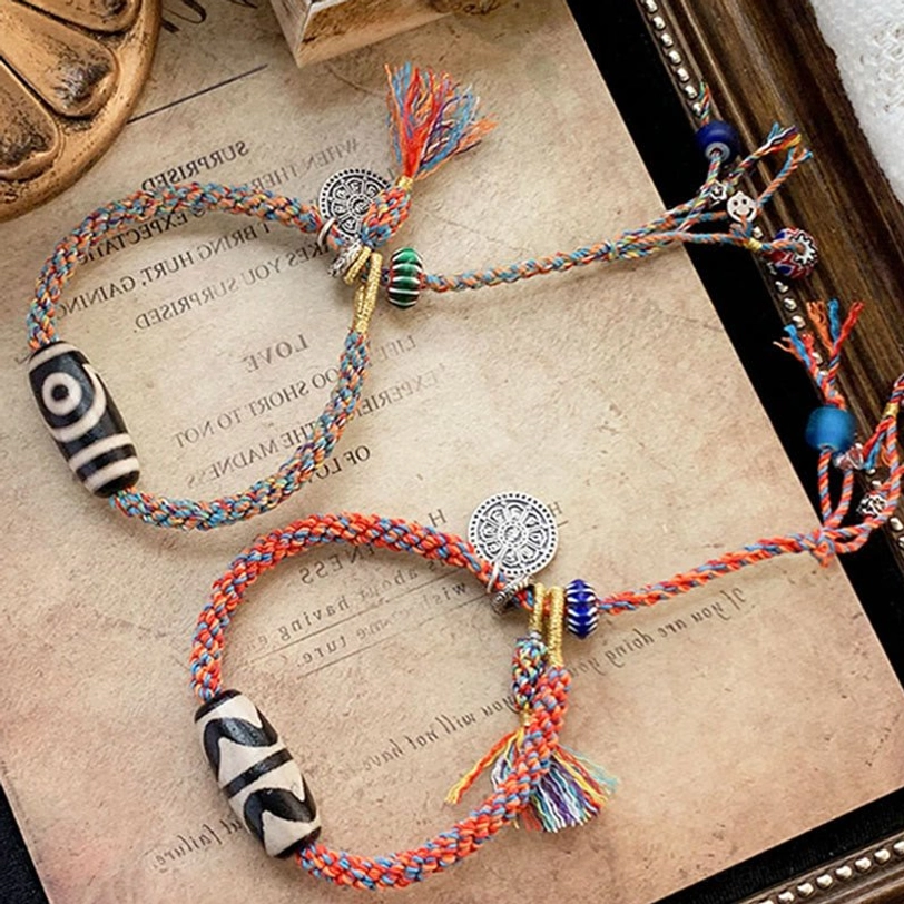 Tibetan Dzi bead bracelet with adjustable woven cord showing sizing and comfort fit on wrist