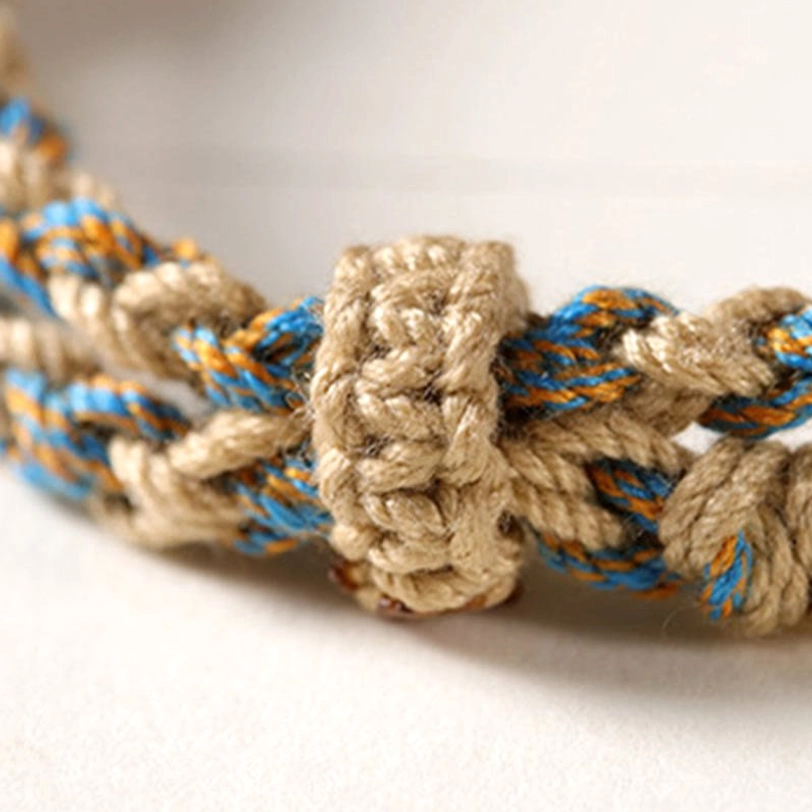 Tibetan Dzi bead spiritual protection bracelet with natural materials and adjustable braided rope design for all wrist sizes