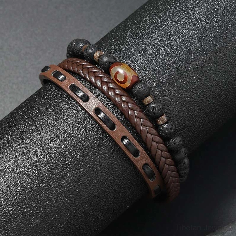 Brown woven leather multi-layer Dzi bead lava rock bracelet showing punched leather strap details