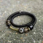 Tibetan Dzi bead double wrap bracelet with ebony wood beads and black onyx - top view flat lay