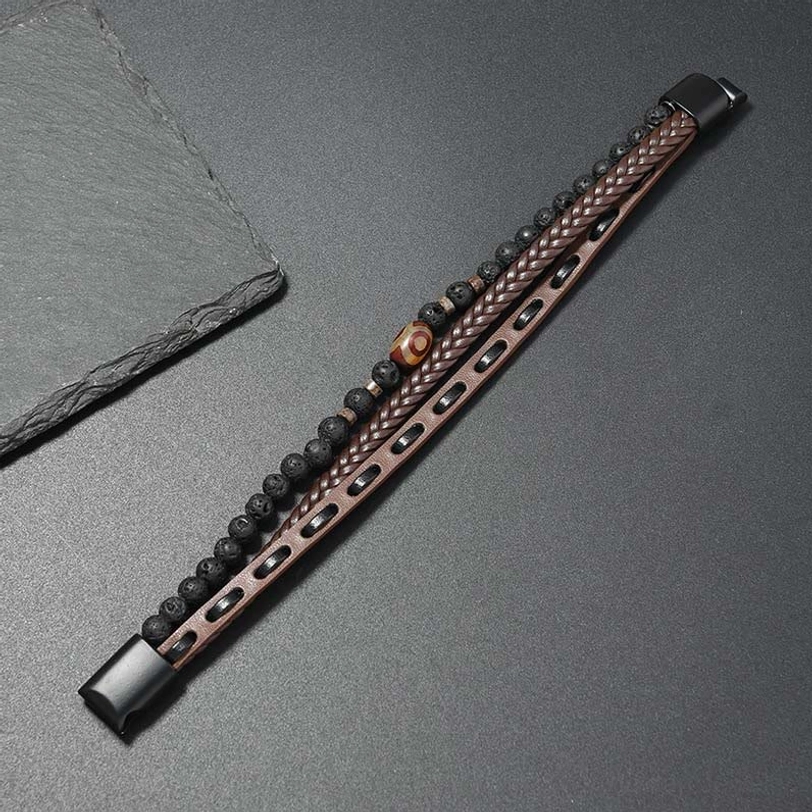 Brown leather woven Nine-Eye Dzi bead lava rock prosperity bracelet with slate size reference top-down view