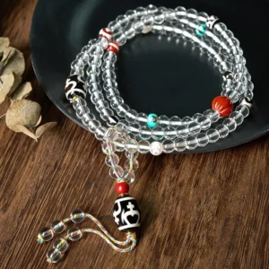 108 bead Tibetan dzi mala crystal bracelet with tassel pendant overhead view