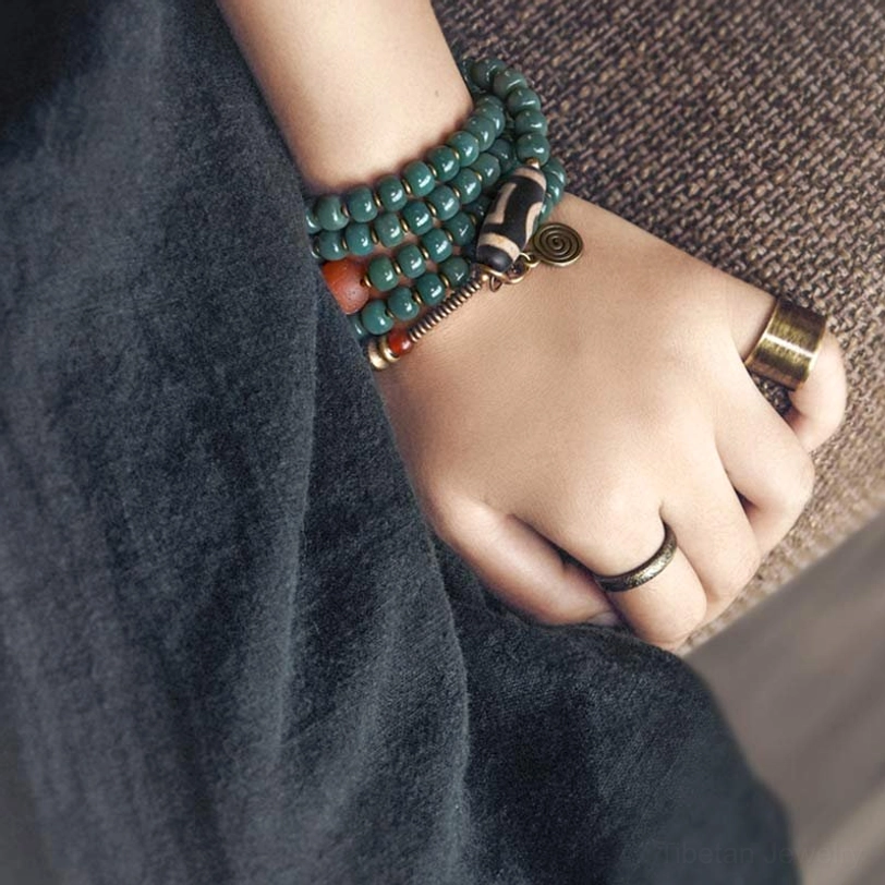 Matching Tibetan Dzi Mala Bracelets Worn on Hand with Brass Ring Details